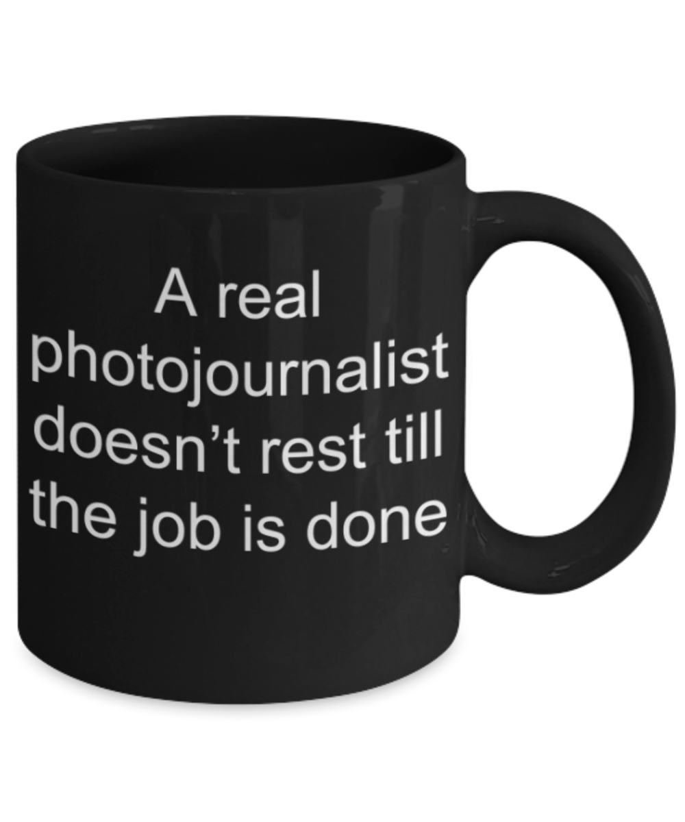 Photojournalist gifts mugs, A real photojournalist doesn't rest till the job is done - Funny Black Porcelain Coffee Mug Cute Ceramic Cup 11 oz