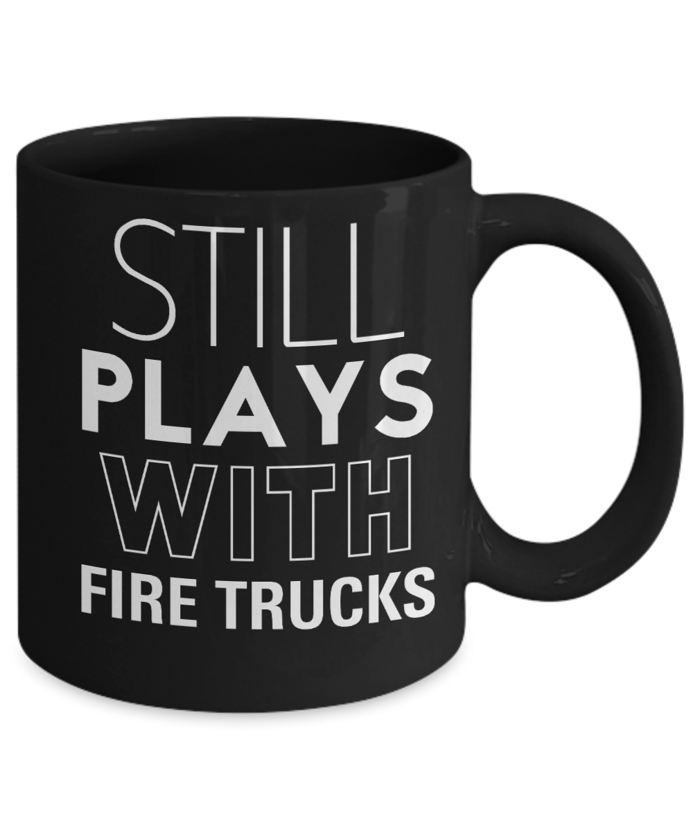 Still plays with Fire Trucks - Funny Black Porcelain Coffee Mug Cute Ceramic Cup 11 oz