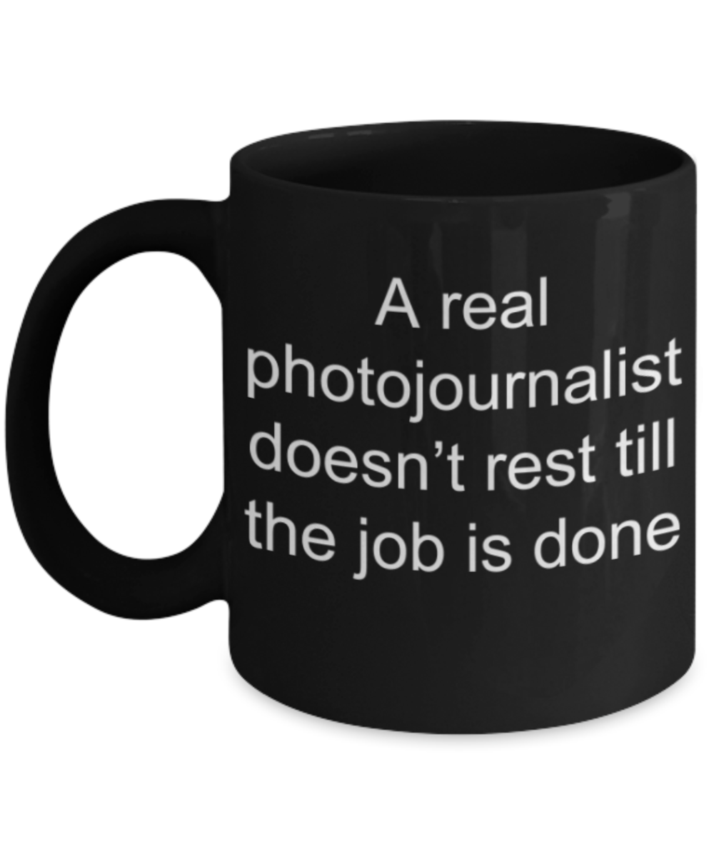 Photojournalist gifts mugs, A real photojournalist doesn't rest till the job is done - Funny Black Porcelain Coffee Mug Cute Ceramic Cup 11 oz